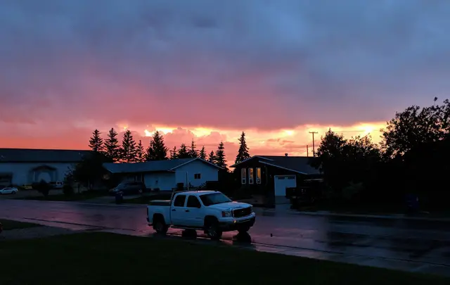 Sunset over a residential street after rain
